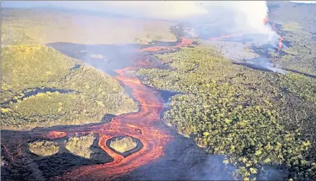  ?? ?? Handout picture released by the dalapagos National park shows an aerial view of lava spewing from a fissure of the tolf solcano after it erupted for the second time in seven years on Jan 7 on fsabela fsland in the dalapagos fslands in the pacific lcean, 900 km off the Ecuadorean coast. — Afp file photo