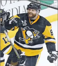  ?? AP/GENE J. PUSKAR ?? Pittsburgh Penguins’ Phil Kessel celebrates his goal Wednesday against the San Jose Sharks with Nick Bonino, left, during the second period in Game 2 of the NHL hockey Stanley Cup Finals in Pittsburgh.