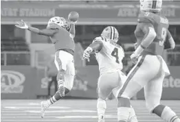  ?? RON JENKINS/AP ?? Miami wide receiver Jeff Thomas, left, makes a one-handed catch for a first down in front of LSU linebacker K’Lavon Chaisson .