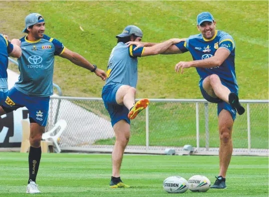 ?? NEW MOVES: Kane Linnett ( left) with Cowboys teammates Johnathan Thurston and Jake Granville at training yesterday. Picture: EVAN MORGAN ??