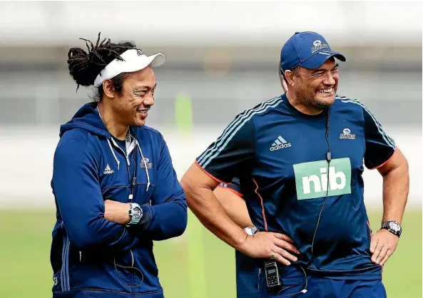  ??  ?? Blues head coach Tana Umaga, left, shares a joke with forwards coach Steve Jackson.