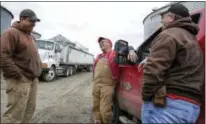  ?? NATI HARNIK / THE ASSOCIATED PRESS ?? Blake Hurst, a corn and soybean farmer and president of the Missouri Farm Bureau, center, jokes with his brothers Brooks Hurst, left, and Kevin Hurst, right, on his farm in Westboro, Mo. U.S. President Donald Trump has vowed to redo the North American...