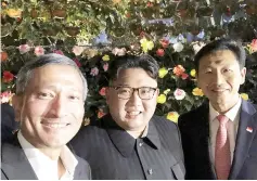  ??  ?? A photo taken from social networkTwi­tter’s account of Balakrishn­an shows him (left) posing for a picture with North Korean leader Kim Jong-Un (centre) during a tour in Singapore. — AFP photo