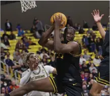 ?? PHOTO BY PAUL RODRIGUEZ ?? Long Beach State forward Lassina Traore, who stands 6-foot-10, is back after averaging 12.9 points and 10.5 rebounds a season ago.
Who's gone:
Who's new: