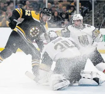  ?? ASSOCIATED PRESS ?? FLURRY OF ACTIVITY: Sean Kuraly has his shot stopped by the Golden Knights’ Malcolm Subban during the Bruins’ 4-1 victory Sunday night at the Garden.