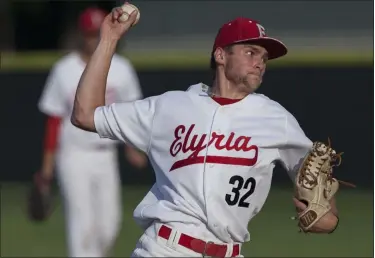  ?? JEN FORBUS — THE MORNING JOURNAL ?? Elyria’s Hunter Olsen winds up to deliver a pitch against Amherst on July 25, 2019.