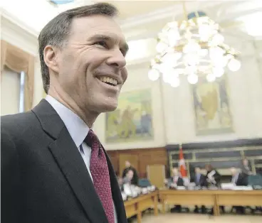  ?? SEAN KILPATRICK / THE CANADIAN PRESS ?? Bill Morneau made his first appearance as finance minister before the House finance committee on Tuesday. Tory Lisa Raitt noted, “We handed you a surplus, Minister, in
November and December of this year when you took over.”