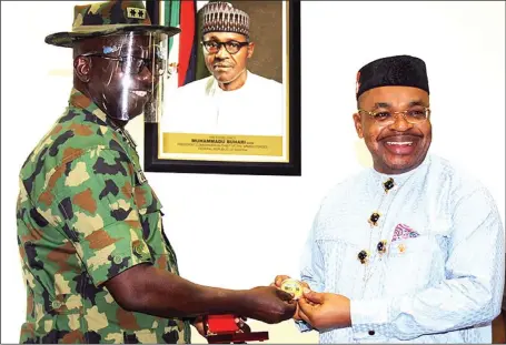  ??  ?? General Officer Commanding 6 Division, Nigerian Army, Maj, Gen. Johnson Irefin (left), and Akwa Ibom State Governor, Mr. Udom Emmanuel, during the army chief’s visit to the governor in Uyo…yesterday