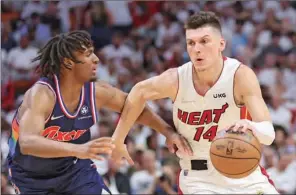  ?? (AFP) ?? Tyler Herro of the Miami Heat drives to the basket against Tyrese Maxey of the Philadelph­ia 76ers during the second half in Game Five of the Eastern Conference Semifinals at FTX Arena in Miami, Florida, on Tuesday.