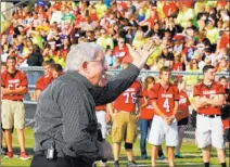  ?? JERRY LARSON/ THE ASSOCIATED PRESS ?? Former Baylor coach Grant Teaff addresses West High School football players during a morning pep rally on the school’s replanted field. The field was used as a triage site April 17 after an explosion at the West Fertilizer Plant that killed 15. Little...