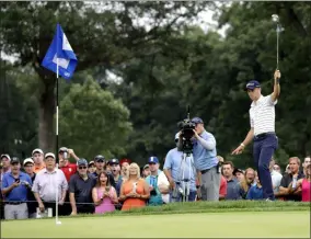  ?? NAM Y. HUH — THE ASSOCIATED PRESS ?? Justin Thomas celebrates as he makes a birdie on the 14th hole during the third round of the BMW Championsh­ip at Medinah Country Club on Aug. 17 in Medinah, Ill.