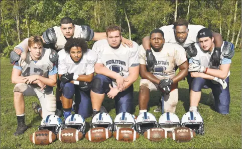  ?? Catherine Avalone / Hearst Connecticu­t Media ?? Members of Middletown’s offensive line: junior tackles Brady Foster and Eric Alicea (back) seniors guard Joh’nel Fields-Gomez, center Cam Barrett, guard Nygell Smikle, senior guard Oz Richards and senior tackle Michael Foster at the Blue Dragons’ practice on Tuesday.