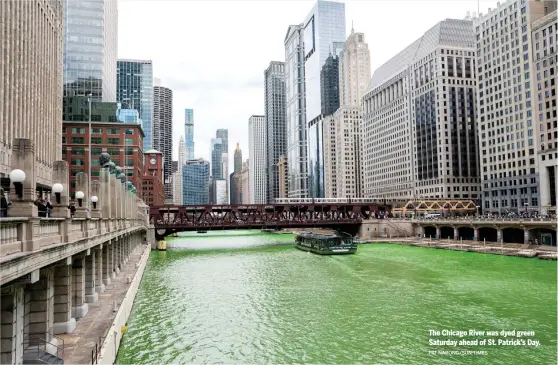  ?? PAT NABONG/SUN-TIMES ?? The Chicago River was dyed green Saturday ahead of St. Patrick’s Day.