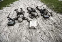  ?? ?? Three U.S. Marine Corps male recruits negotiate an obstacle during a portion of training known as the Crucible at the Marine Corps Recruit Depot in Parris Island, South Carolina. More than 9 of 10 Marines are men.