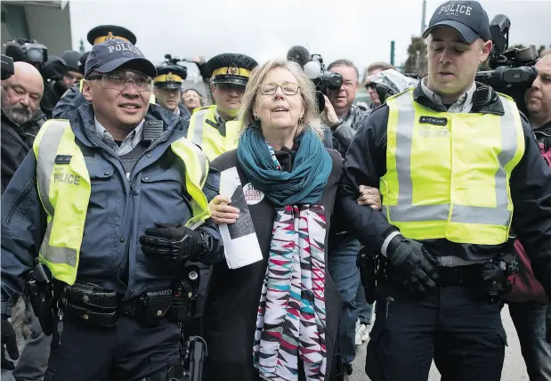  ?? DARRYL DYCK / THE CANADIAN PRESS ?? Elizabeth May is arrested Friday after joining a protest in Burnaby against the expansion of Kinder Morgan Canada’s Trans Mountain pipeline.