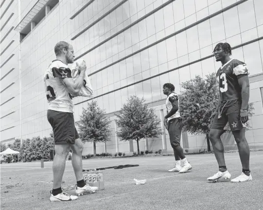  ?? TOM FOX TNS ?? Dallas Cowboys wide receiver David Durden (left), tight end John Stephens (center) and linebacker DeMarvion Overshown take a break from rehab during the team's mandatory minicamp at The Star in Frisco, Texas, June 5. All suffered a torn left ACL last August.