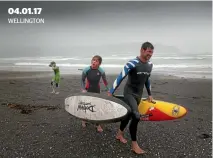  ?? ROSS GIBLIN \ FAIRFAX NZ ?? 04.01.17 WELLINGTON Steven Kilduff with his surfer kids Sam, 11 and Paige, 13 struggle out of the water as a mid-afternoon squall hits Lyall Bay in Wellington.