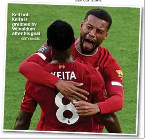  ?? GETTY IMAGES ?? Red hot: Keita is grabbed by Wijnaldum after his goal