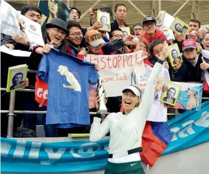  ?? AP ?? Maria Sharapova celebrates with her fans after defeating Aryna Sabalenka in the Tianjin Open final on Sunday. —