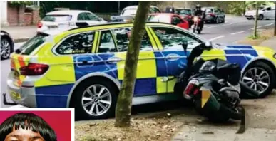  ??  ?? Halted: A moped on its side after being blocked by a police car