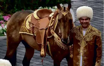  ??  ?? ABOVE: President Berdimuham­edov poses with an ancient Akhal-Teke breed studhorse, Begkhan, that won an ‘Internatio­nal Annual Horse Beauty Contest’ in Ashgabat in 2016.