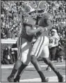  ?? AP/CURTIS COMPTON ?? Georgia running back Nick Chubb (27) celebrates with Chris Conley during the Bulldogs’ 55-6 victory over Charleston Southern on Saturday. Chubb finished with 113 yards and two touchdowns.