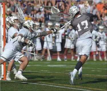  ?? PETE BANNAN — MEDIA NEWS GROUP ?? Conestoga’s Will Schnorr fires a second half backhand goal but the Pioneers fell to La Salle 7-5 Saturday at West Chester East High School.