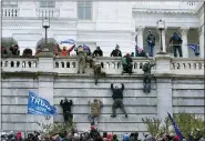  ?? JOSE LUIS MAGANA — THE ASSOCIATED PRESS ?? Supporters of President Donald Trump climb the west wall of the the U.S. Capitol on Wednesday in Washington.