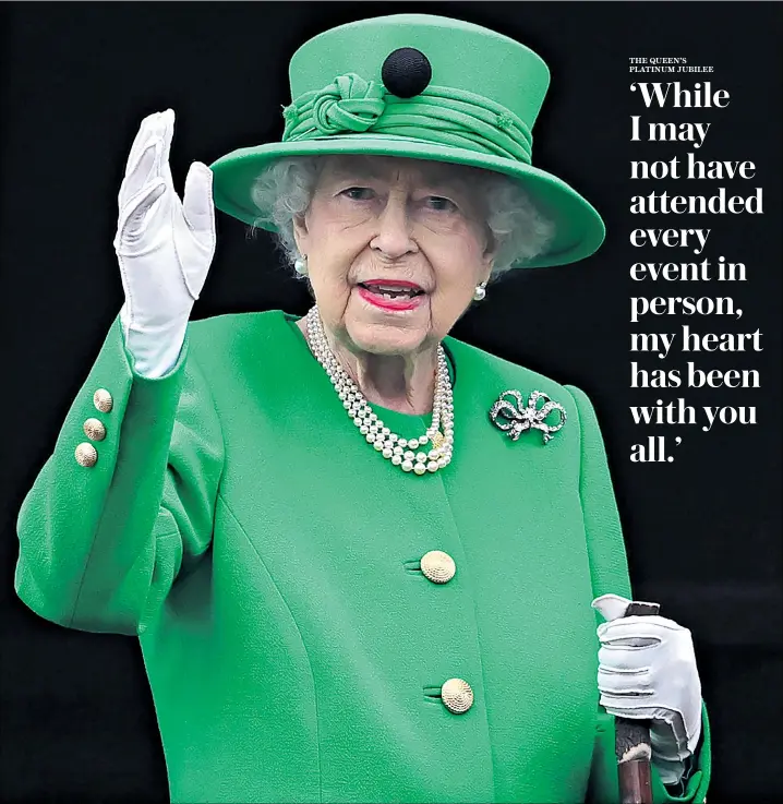  ?? ?? The Queen on the palace balcony holding the treasured walking stick that belonged to the late Duke of Edinburgh