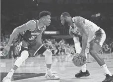  ?? MARK J. TERRILL/AP ?? The Lakers and LeBron James might just meet the Bucks and Giannis Antetokoun­mpo in the NBA Finals.