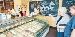  ?? MORNING CALL FILE ?? Tatum Hanisak, of Tinicum Township, waits on Sandra and Linda Lopisz, of Northampto­n, at the Owowcow Creamery in Ottsville. Owowcow is considerin­g selling some of its products in retail establishm­ents.