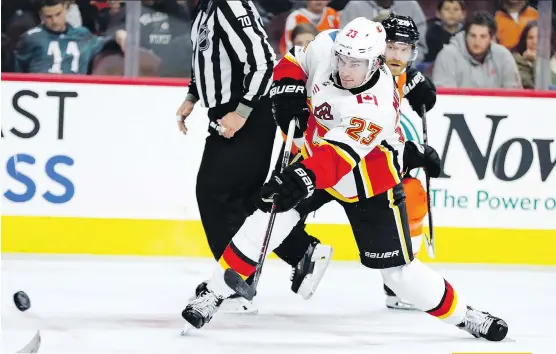  ?? CHRIS SZAGOLA/THE ASSOCIATED PRESS ?? Flames centre Sean Monahan has scored 14 goals and 26 points in 23 games and has been doing double duty for head coach Glen Gulutzan, who often sends Monahan out with Micheal Ferland and Johnny Gaudreau to shut down the opposing team’s top line.