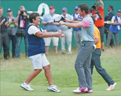  ?? SCOTT HEPPELL / ASSOCIATED PRESS ?? Rory McIlroy celebrates winning the British Open with his mother, Rosie, at Royal Liverpool, Hoylake, England, on Sunday.