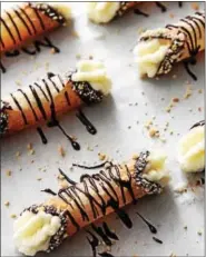  ?? PHOTO COURTESY OF BAKERS ROYALE ?? Can you tell? These brown butter rum cannoli use wonton wrappers.