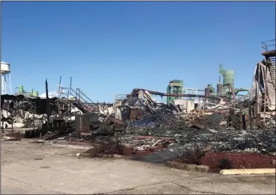  ?? COURTESY OF CROSSETT FIRE DEPARTMENT ?? Aftermath: Smoldering remnants of the Georgia Pacific plywood mill in Crossett are shown Sunday, the day after a large fire at the mill, which was been closed for years, prompted evacuation­s in the area. The mill was in the process of being demolished...