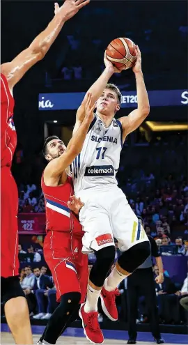  ?? LEFTERIS PITARAKIS / AP 2017 ?? Slovenian-born Luka Doncic (77) is the most intriguing player available. He’s 19 and 6 feet 8. He can shoot and pass. NBAdraft.net lists Toni Kukoc and Hedo Turkoglu as his closest comparison­s, and both were fine NBA players.