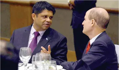  ?? Photo: VILIMONI VAGANALAU ?? From left: Attorney-General and Minister for Economy Aiyaz Sayed-Khaiyum with the world leading expert Ron Kaufman at the Grand Pacific Hotel last night.