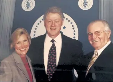  ?? COURTESY OF LISA TIMPÉ DUNFE ?? Lowell native John P. "Jack" Dunfey and his wife Lisa Timpé Dunfey pose with President Bill Clinton.