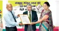  ??  ?? From left: SLSI Director General Dr. Lalith Senaweera handing over the SLS certificat­e to Renuka Agri Foods PLC Ceo/director Vasantha Kumar Shanmugam and Director Quality Assurance Rangika Wijesuriya