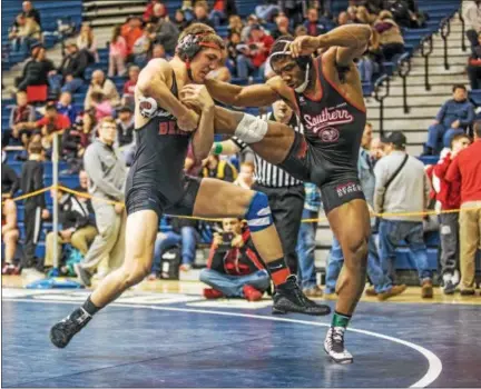  ?? NATE HECKENBERG­ER - FOR DIGITAL FIRST MEDIA ?? Boyertown’s Elijah Jones finishes a takedown against South Philadelph­ia’s Miles Lee on his way to a 4-2 decision in the 182-pound consolatio­n final at the Escape the Rock tournament Sunday.