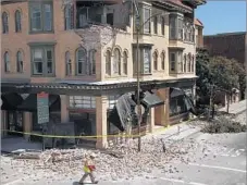  ?? RICK LOOMIS Los Angeles Times ?? DAN KAVARIAN, chief building official for the city of Napa, redtags structures damaged in a 6.0 earthquake in 2014. After the temblor, South Pasadena began studying its own seismic vulnerabil­ities.