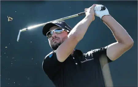  ?? Christian Petersen, Getty Images ?? Kyle Stanley hits his tee shot on the 16th hole during Sunday’s final round of the Waste Management Phoenix Open.