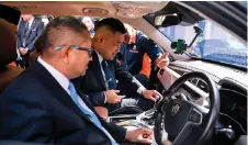  ?? — Bernama photo ?? Wong and Elmi (left) test the Smart Parking Solutions system developed by HTP.