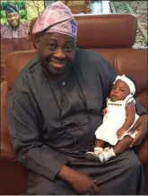  ??  ?? Baby Imade Adeleke carried by Dele Momodu