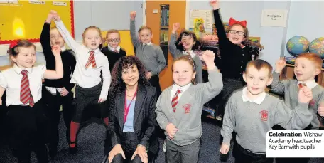  ??  ?? Celebratio­n Wishaw Academy headteache­r Kay Barr with pupils