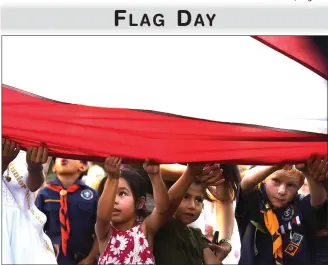  ?? RECORDER PHOTO BY CHIEKO HARA ?? Children help fold the old flag Wednesday during Portervill­e’s 36th annual Flag Day Celebratio­n.