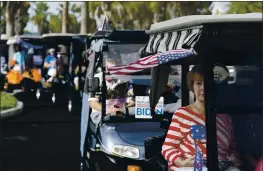 ?? JOHN RAOUX — THE ASSOCIATED PRESS ?? Carts line up before a parade of over 300 golf carts supporting Democratic presidenti­al candidate and former Vice President Joe Biden caravanned to the Sumter County Elections office to drop off their ballots Wednesday in The Villages, Fla.