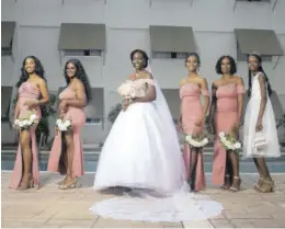  ?? ?? Yaneek with her maid of honour Tyler Rae Nesbeth Rerrie (third right), flower girl and sister Malika Cooper (right), bridesmaid­s (from left) Shanae Montaque, cousin Tasheka Richards, and sister Kadene Everett