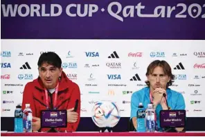  ?? (AFP) ?? Croatia’s coach Zlatko Dalic and Croatia’s midfielder Luka Modric (right) address a press conference at the Qatar National Convention Centre in Doha on the eve of their Qatar 2022 World Cup match against Morocco.