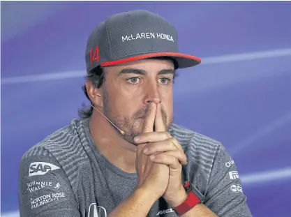  ??  ?? McLaren driver Fernando Alonso attends a news conference ahead of the Singapore Grand Prix.
